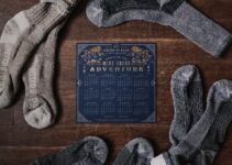 pair of gray socks and blue calendar on table
