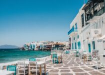 white and brown concrete buildings near sea during daytime