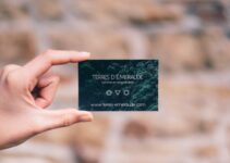 person holding black and white card