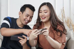 man and woman siting on sofa chair inside room