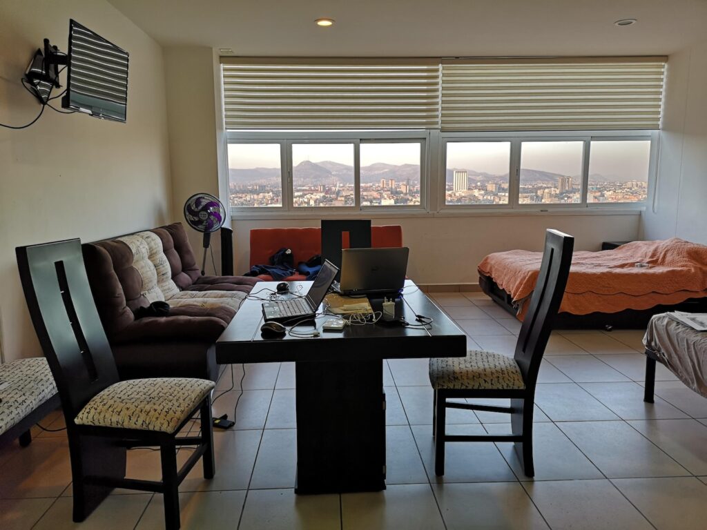 black laptop computer on brown wooden table