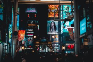 people walking on streets at nighttime