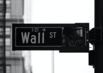 grayscale photo of Wall St. signage