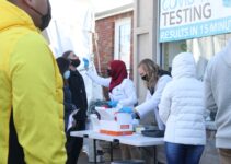 people standing near white table during daytime