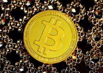 gold round coin on black beads