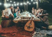 people sitting on chair in front of table with candles and candles