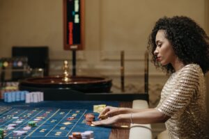 A Woman Betting on a Roulette Table
