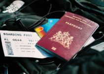a passport and a boarding pass are on a bag