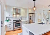 white wooden kitchen cabinet and white kitchen counter