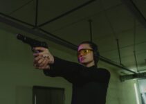 A Woman Holding a Pistol