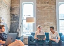 three men using MacBooks