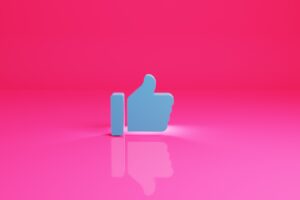 a thumbs up sign on a pink background