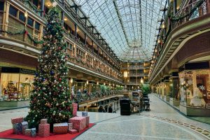 state of the art building interior with lit Christmas tree