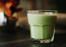 green liquid in clear drinking glass
