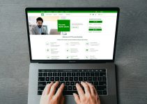 a person typing on a laptop with their hands