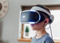 boy wearing black and white VR headset