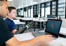 man in blue crew neck t-shirt using black laptop computer