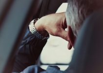 person wearing silver and gold bracelet