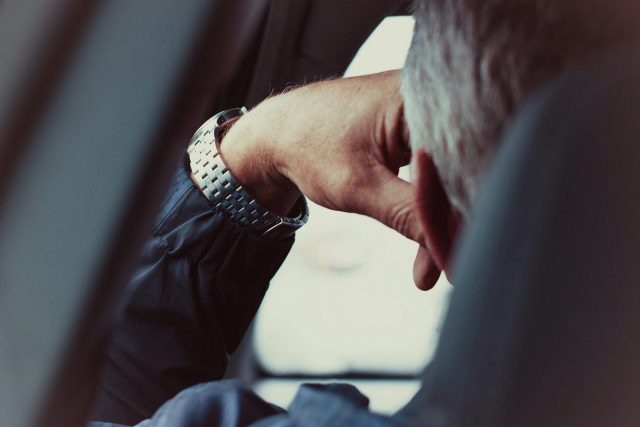 person wearing silver and gold bracelet