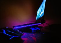 a computer desk with a mouse and a monitor