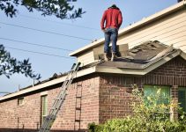 a man standing on the roof of a house