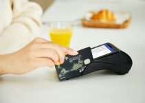 person holding black and white card