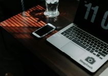 silver iphone 6 on macbook pro