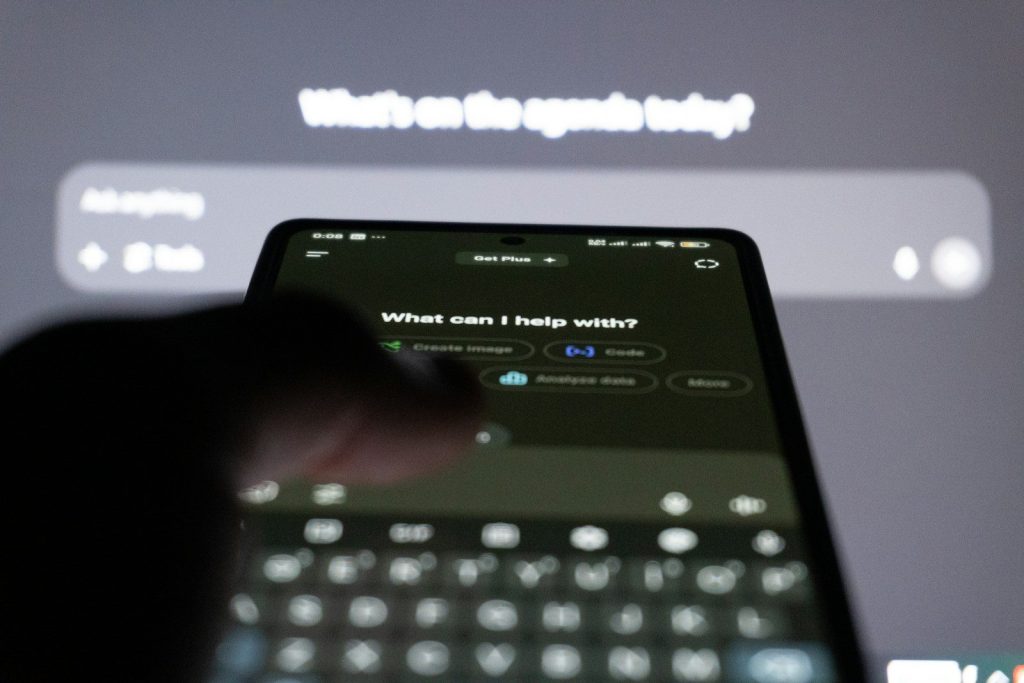 Person typing on smartphone with ai chatbot on screen